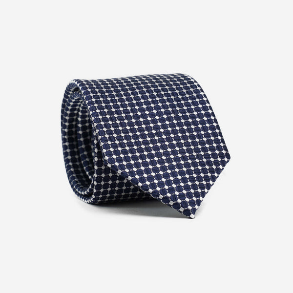 Μεταξωτή γραβάτα 7,5εκ σε μπλέ βάση με μικρό λευκό σχέδιο