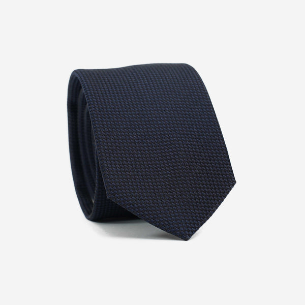 Γραβάτα μεταξωτή στενή μονόχρωμη σε μπλέ απόχρωση με ανάγλυφο σχέδιο τόνο στο τόνο